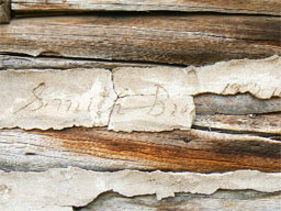 Smith Bros. 1924 signature in chinking on cabin